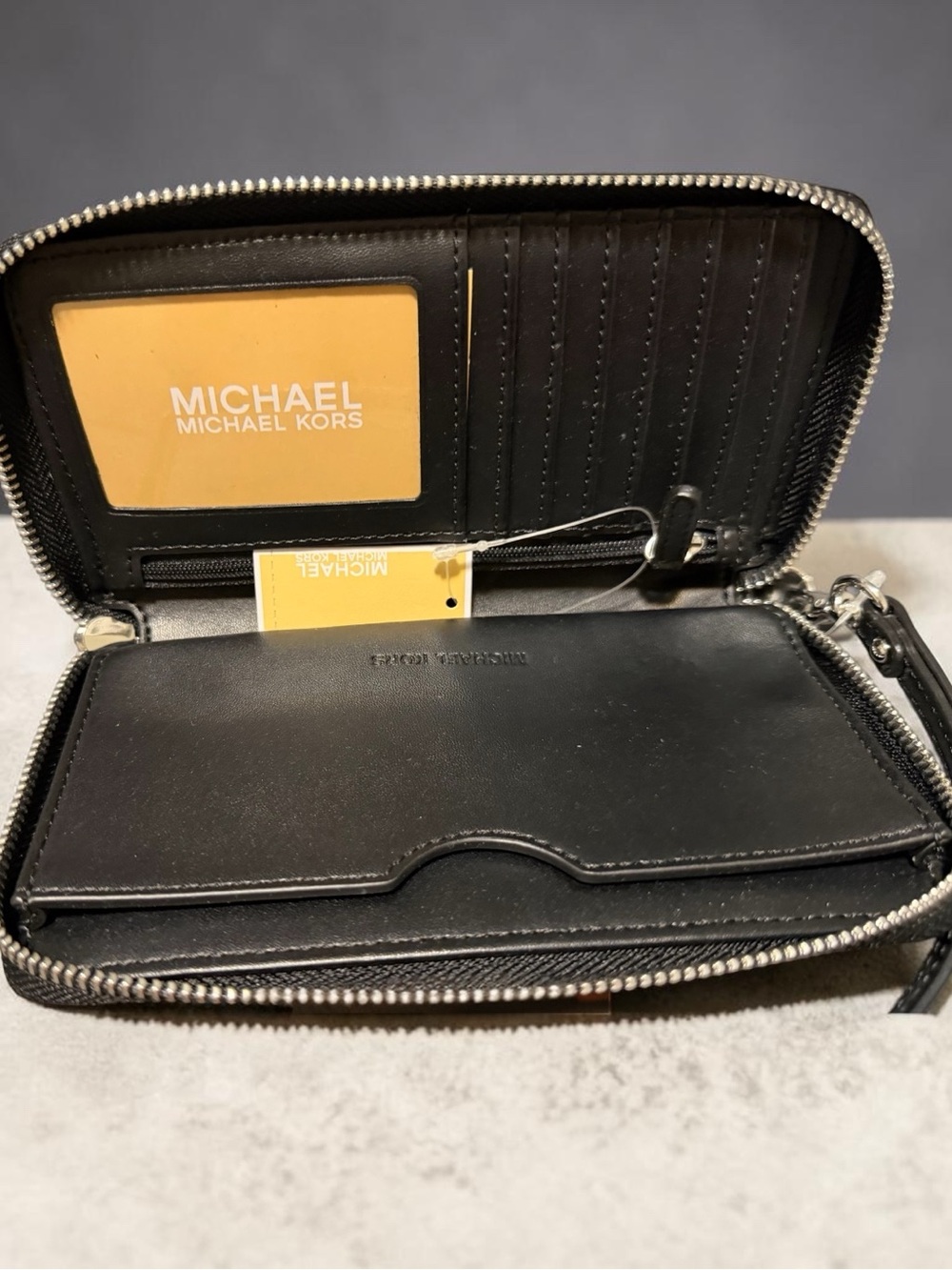 Michael Kors Black Pebbled Leather Zip Wristlet with Silver MK Logo - Picture 2 of 2